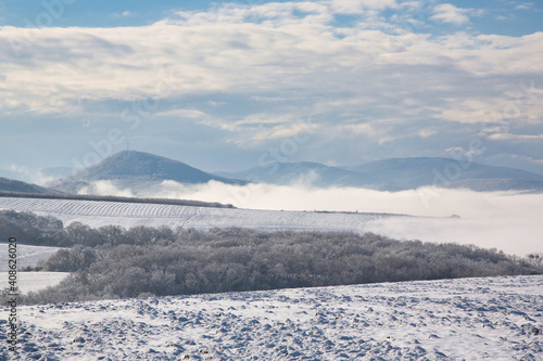 winter mountain landscape with fog © Elizaphoto
