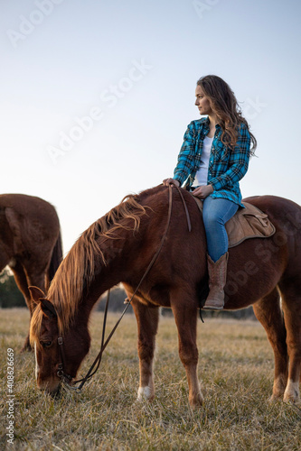 Girl Looking Off into Scenic Distance on Horseback