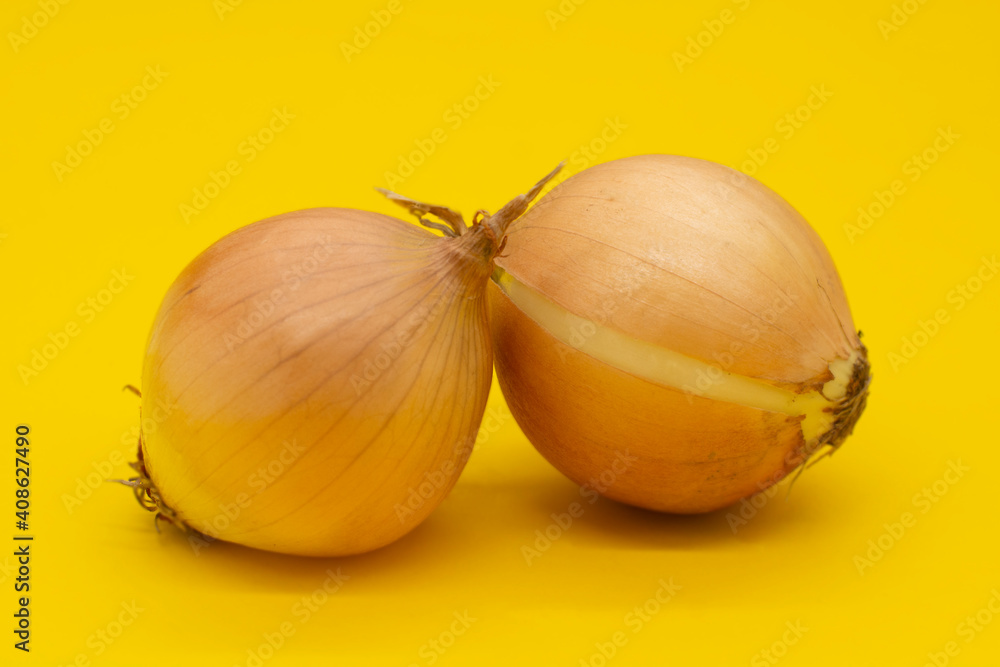 fresh onion on a yellow background. Vegetables fresh onion on a yellow background. Vegetables
