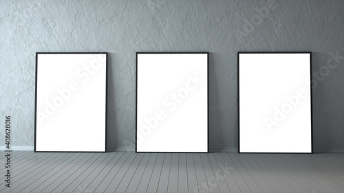 Three blank picture frames on a wood floor. 3d rendering
