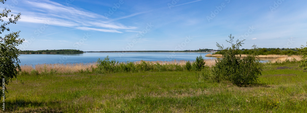 Panorama of renaturized brown coal open pit landscape with the lake Grosser Goitzschesee near the town of Bitterfeld, Germany, Europe