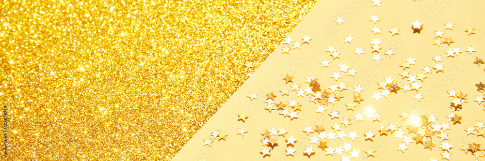Gold stars background. Yellow glitter backdrop. Golden texture. New year luxury snow. Copyspace, banner. Shimmer confetti wallpaper. Dreamy shiny design detail