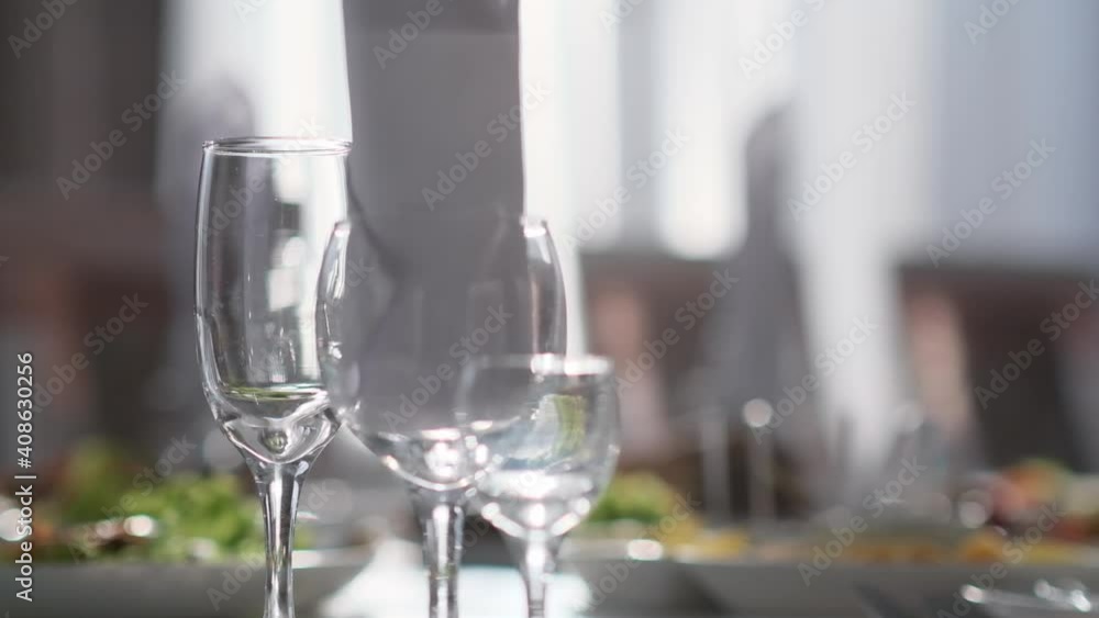 Crystal clear goblets of different sizes on the table Crystal clear goblets of different sizes on the table