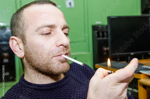 portrait of a person with a cigarette
