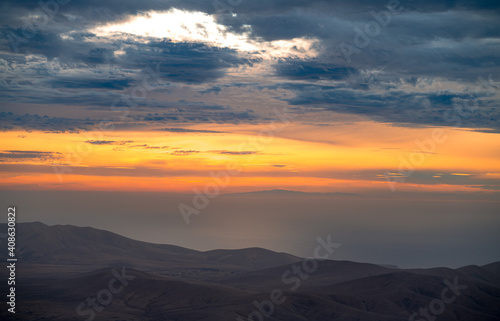 Incredible sunset from the mountain with views and red color © Nelson