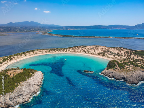 Aerial panorama view of the famous semicircular sandy beach and lagoon of Voidokilia in Messenia, Greece