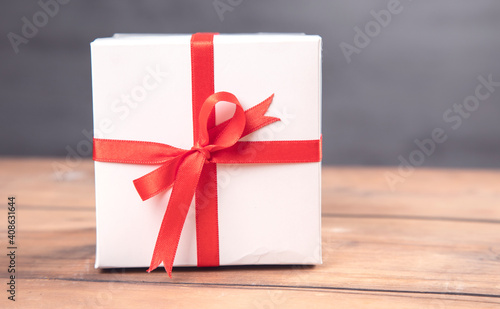 white gift box on wooden table