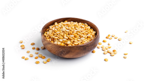 Peas in a wooden bowl isolated on a white background.