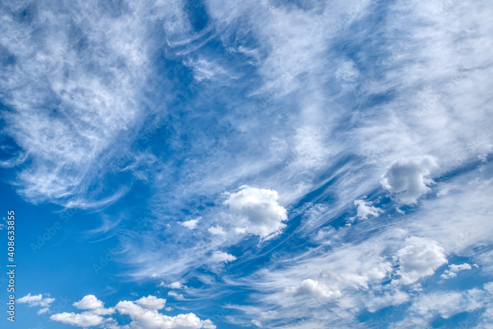 White fluffy clouds in the blue sky White fluffy clouds in the blue sky