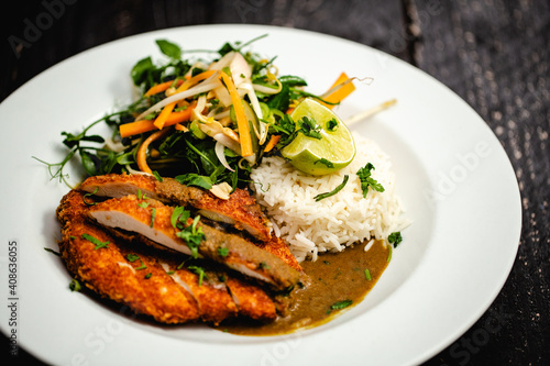 Chicken Katsu Curry with fragrant basmati rice, beansprouts, pea shoot, peanut and pickled vegetable salad