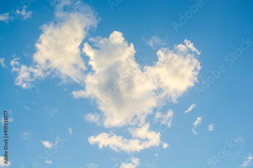 white cloud in the form of a heart on a blue sky background