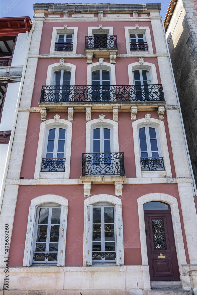 Fototapeta premium Traditional red and white Basque houses - typical architecture of Saint Jean de Luz, Pyrenees-Atlantiques department in southwestern France.