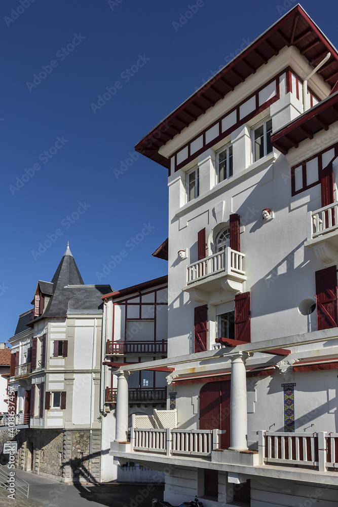 Traditional red and white Basque houses - typical architecture of Saint Jean de Luz, Pyrenees-Atlantiques department in southwestern France.