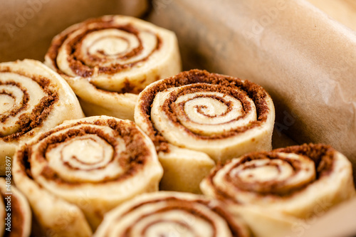 Tableau sur toile Raw cinnamon roll dough being prepared ready for baking