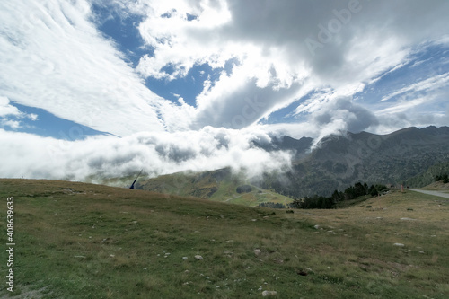 Selective focus - Beautiful view of impressive clouds covering the Pyrenees mountains.