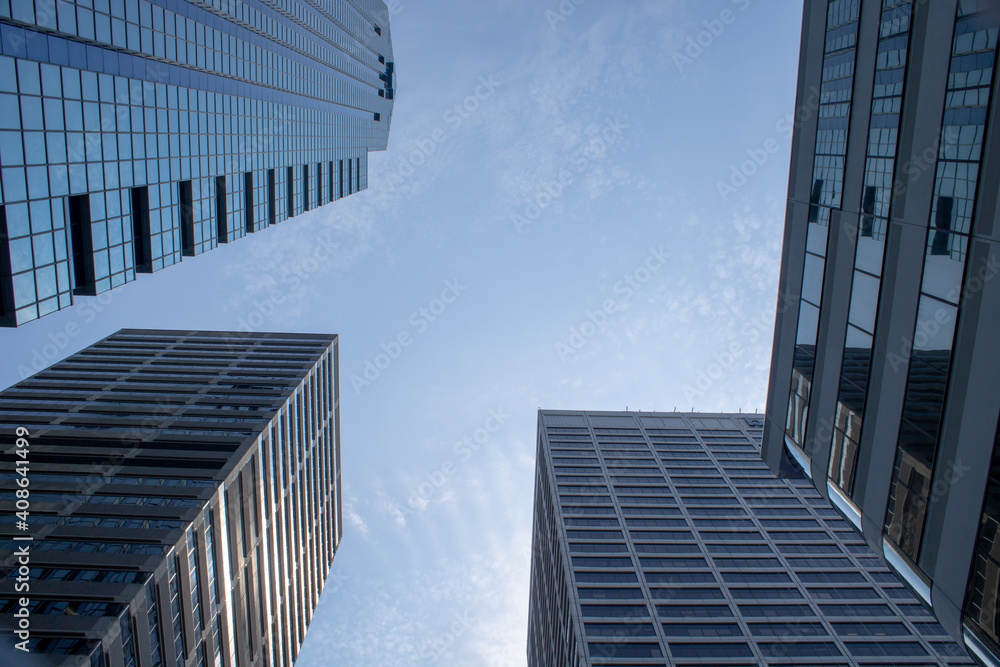 Four skyscrapers with a blue sky, concept of business growth Four skyscrapers with a blue sky, concept of business growth