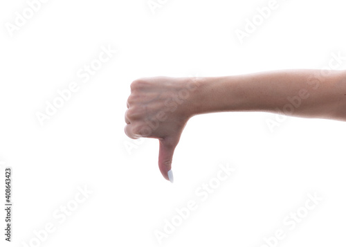 Female hand showing a thumb down gesture. Isolated on white background. Dislike.