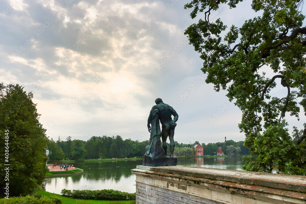 Naklejka premium The Samson statue seen from behind with the pond and lake in view in the Gardens of Catherine Palace in Pushkin, Russia