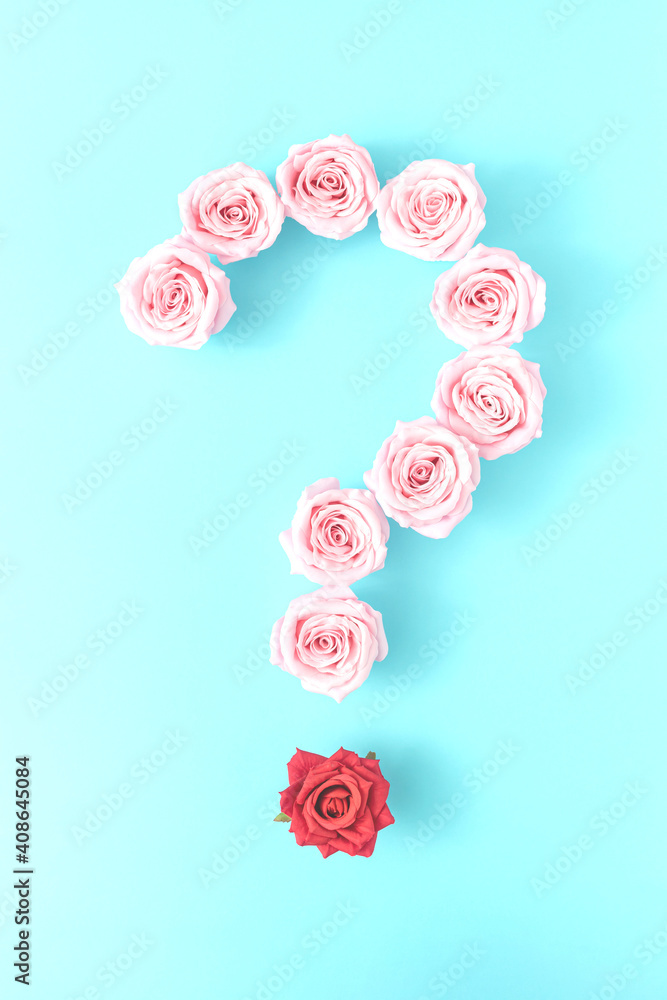 Fototapeta premium Question mark made from bright pink rose flowers and one red rose against bright blue background. Minimal flat lay concept.