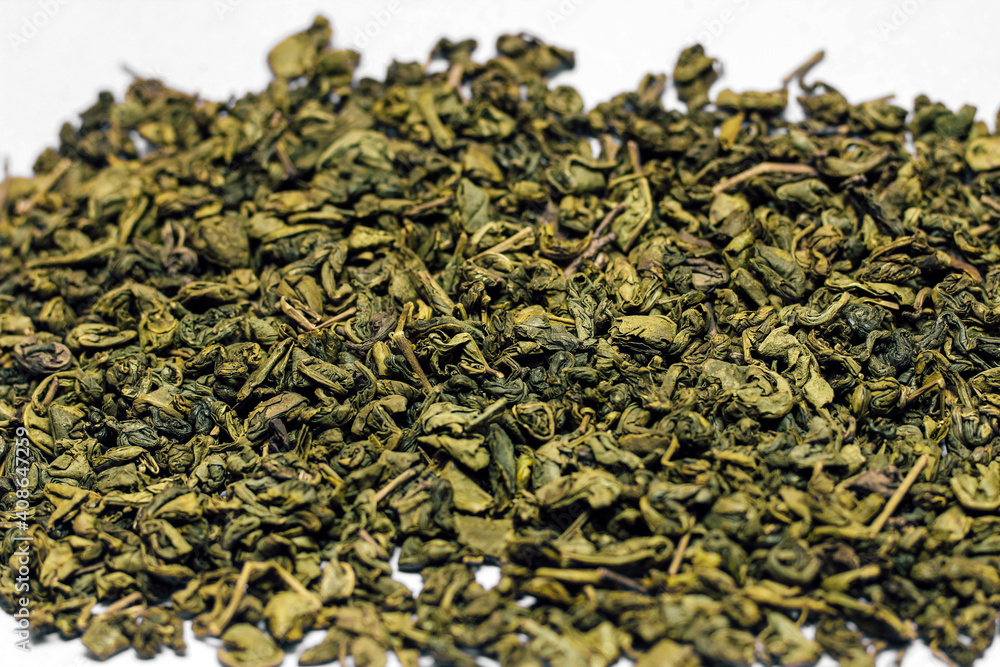 Gunpowder Green Tea Scattered. Large tea leaves close up. Gunpowder Green Tea Scattered. Large tea leaves close up.