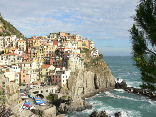 View of colorful Manarola village built on a cliff by the Ligurian sea.  Cinque Terre, Italy photo