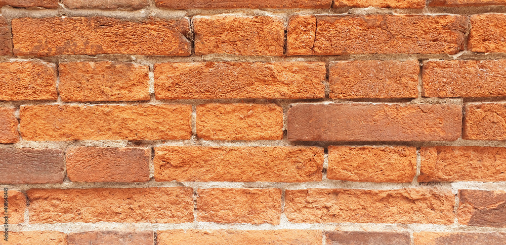 Obraz premium Orange brick wall background. Panorama.