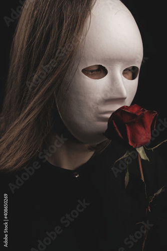 a romantic woman in a white mask photo