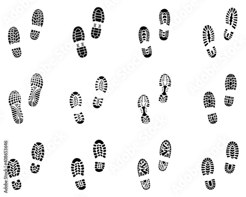 Various black prints of shoes on a white background