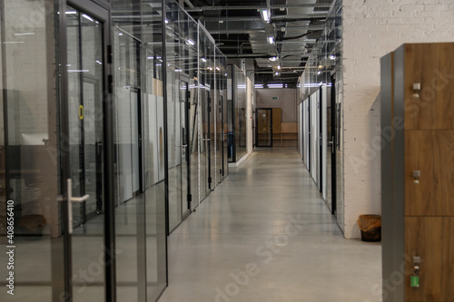 Modern empty office with glass partitions, loft style interior. Perspective view