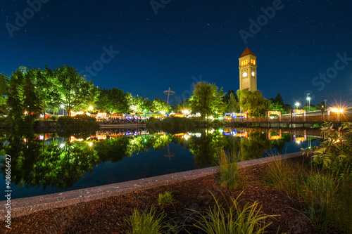 Εκτύπωση καμβά The Spokane Washington clocktower in Riverfront Park shines above the Spokane Ri
