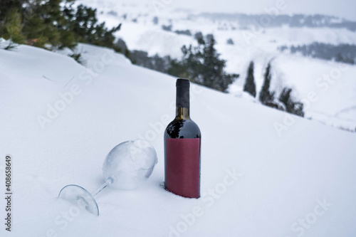 Wine in nature in the snow