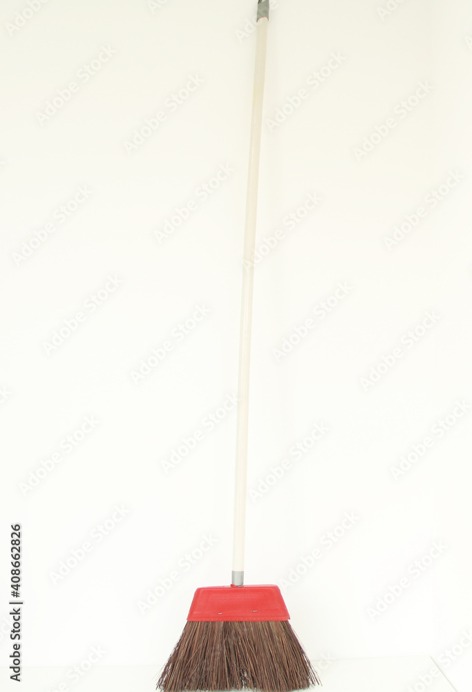 Piassava, piaçava broom with long wooden handle isolated on white background, São Paulo, Brazil Piassava, piaçava broom with long wooden handle isolated on white background, São Paulo, Brazil