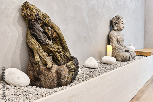 Physiotherapy abstract chill out place with a buddha and a little water fountain