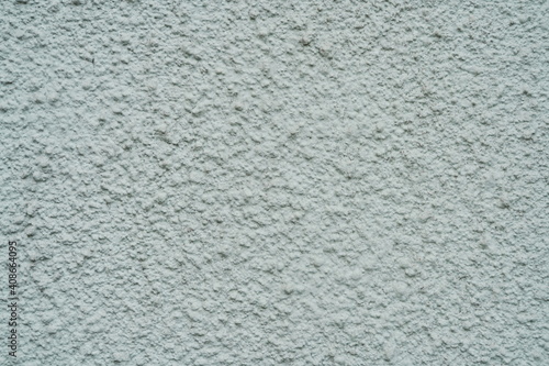 Light plastered wall with defects texture close up