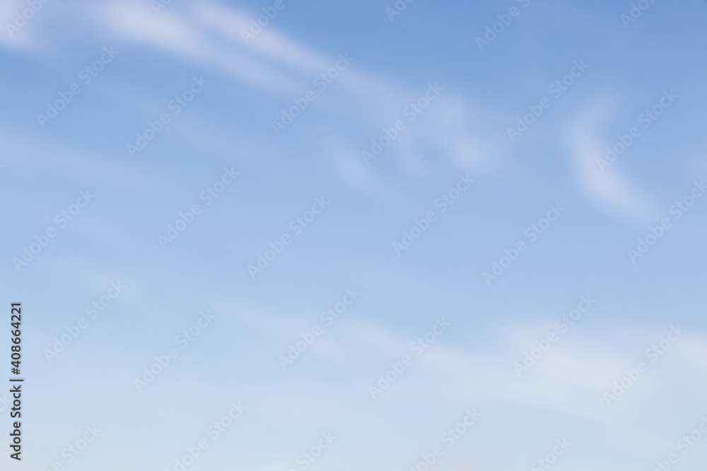 Beautiful blue sky with light clouds background with soft focus. Empty sky background for your design. Nature background.