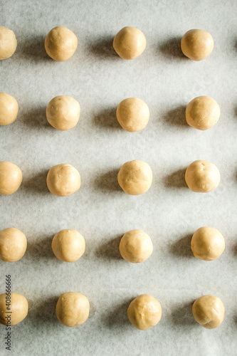 peanut butter dough balls on a baking tray