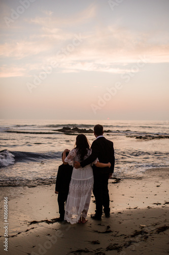 Newlyweds & Nine Year Old Son on Beach at Sunset in San Diego photo