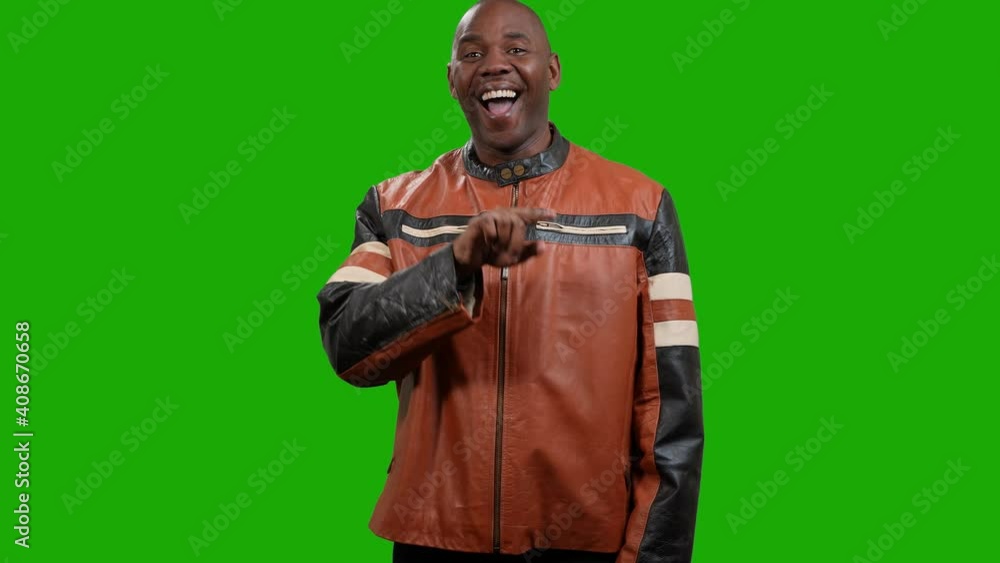 African American man points to center of screen then makes larger and larger circles with his hand on green screen background African American man points to center of screen then makes larger and larger circles with his hand on green screen background