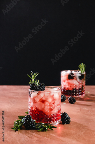 blackberry whiskey cocktail with rosemary garnish