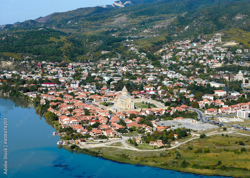 Historic town of Mtskheta, Georgia showing Svetitskhoveli Cathedral and Mtkvari (Kura) River. Natural landscape and historic city. Former capital.