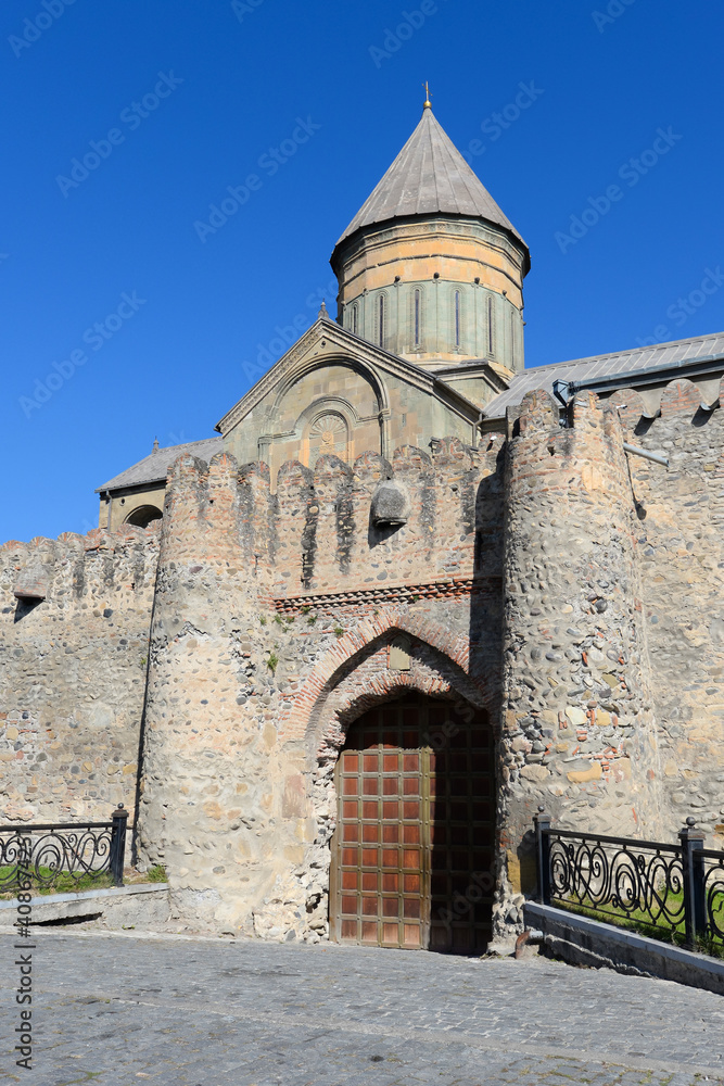 Vertical photo of Svetitskhoveli Cathedral from outside the wall gate. Orthodox Christian church located in Mtskheta, Georgia in the Caucasus.