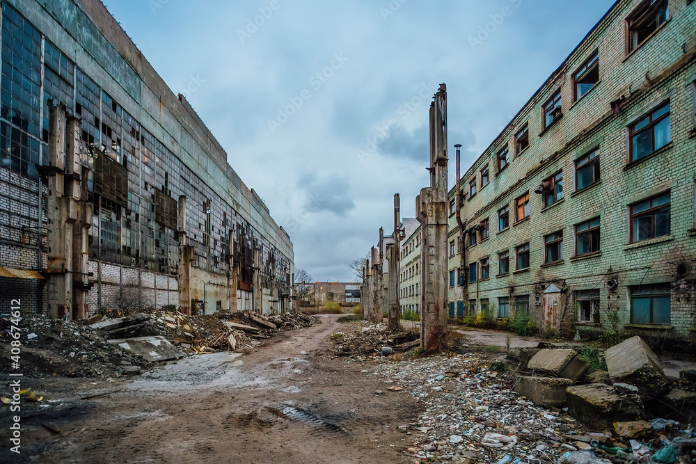 Territory of abandoned industrial area waiting for demolition. Broken buildings. Former Voronezh excavator factory
