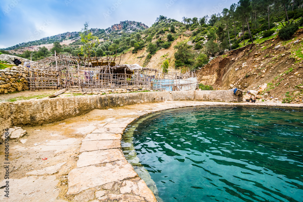 Fototapeta premium Moulay Idriss, Morocco - April 09, 2015. Roman bath with hot spring with circular pool