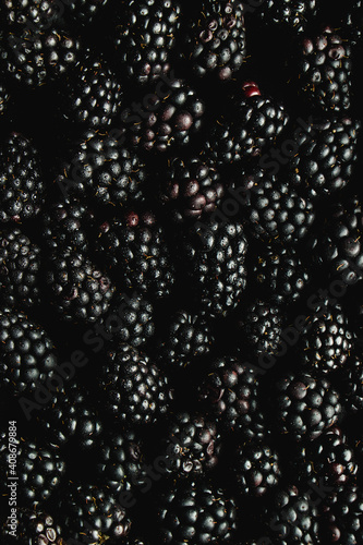 bowl of blackberries on black