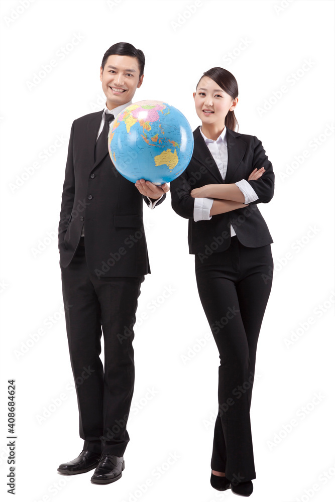 Business people holding a globe