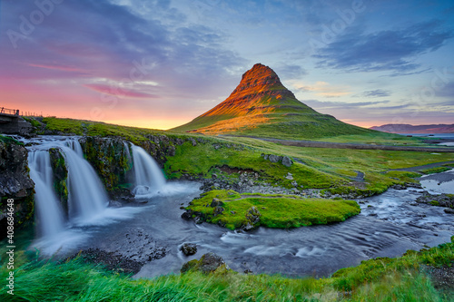 Awesome evening with Kirkjufell volcano the coast of Snaefellsnes peninsula. Dramatic and picturesque scene. Location famous place Kirkjufellsfoss waterfall  Iceland  Europe  travel. Beauty world.