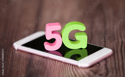 A phone and 5g alphanumeric model on the screen