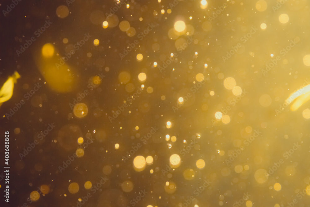 Dark Abstract Gold bokeh sparkle on black Dark Abstract Gold bokeh sparkle on black