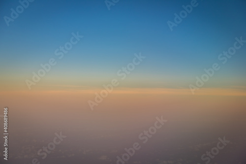 Beautiful blue sky before sunset with clouds shoot on airplane
