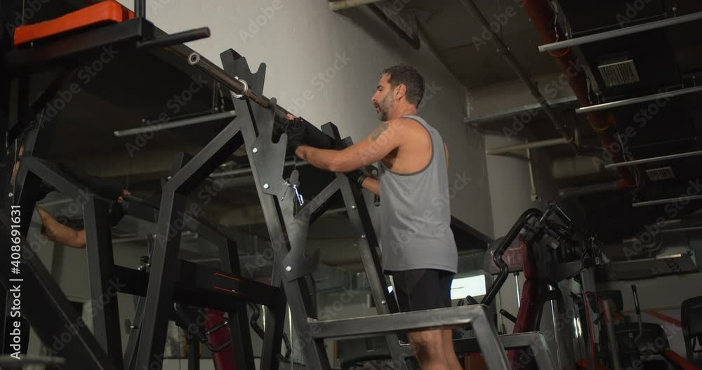 Man weightlifting in the gym Man weightlifting in the gym